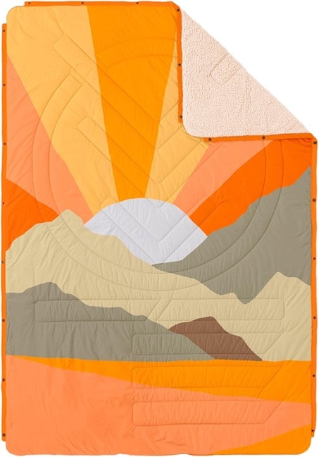 A blanket with mountains and sun