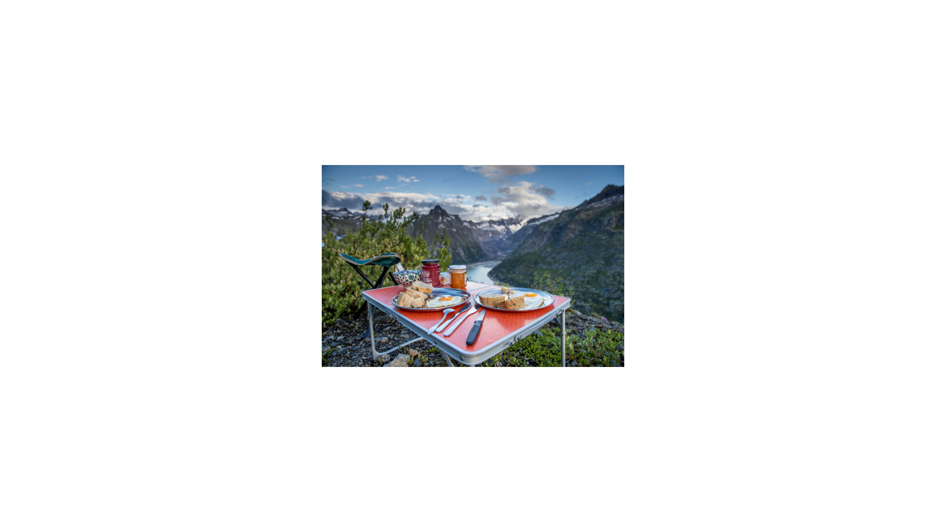 Breakfast on a table with a view of the mountains