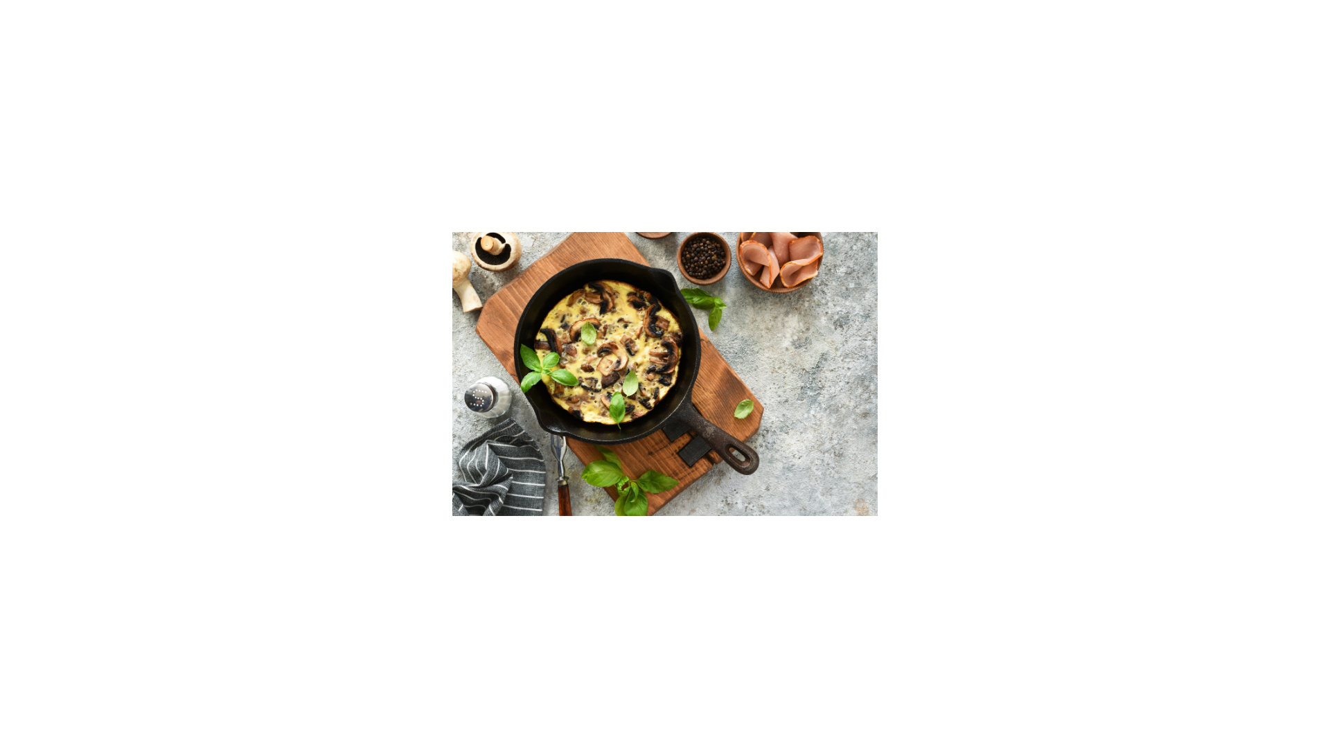 cast iron skillet with a frittata cooked in it sitting on a table