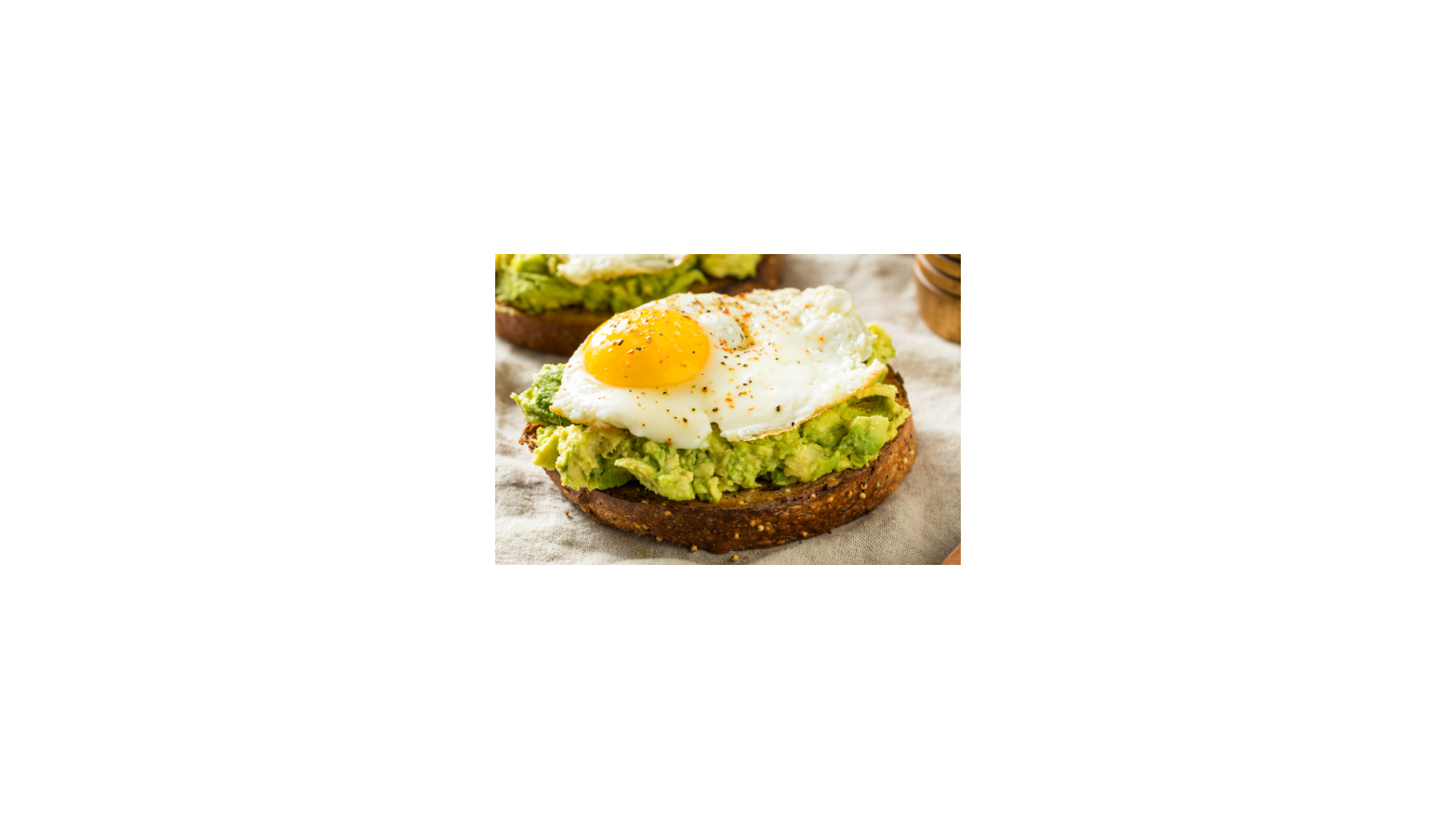 a piece of toast with avocado and an egg on it