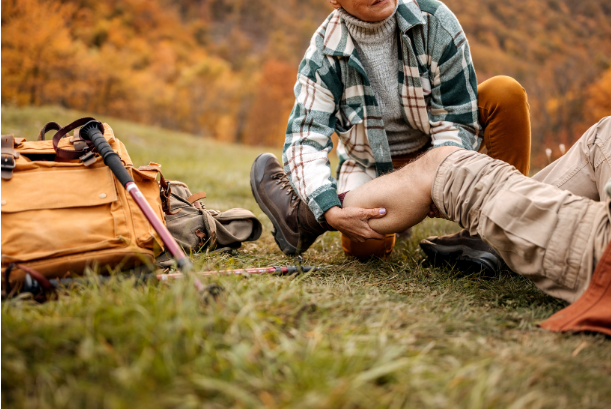 Person receiving first aid in wilderness