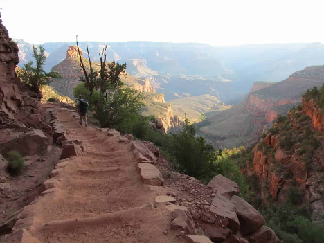 A person walking on a trail.