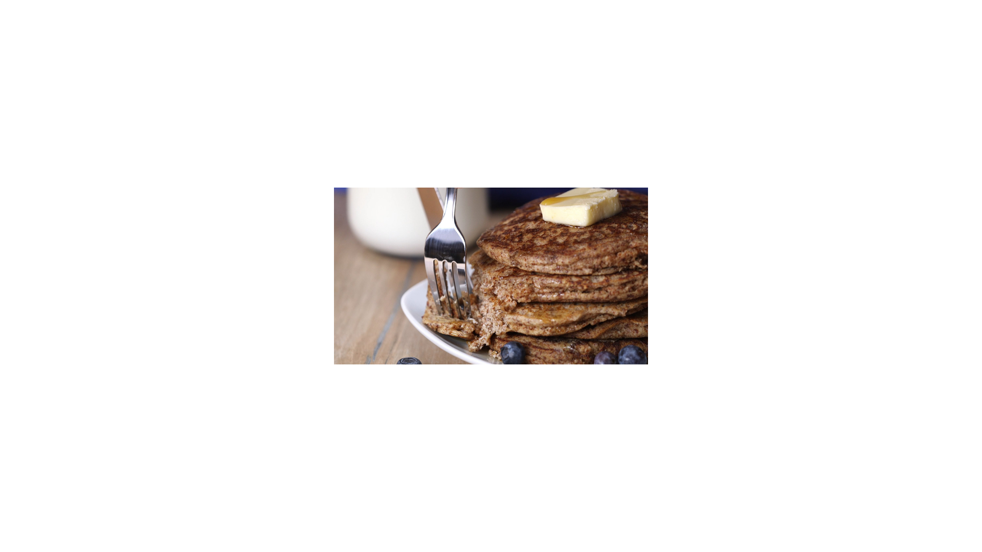 Buckwheat pancakes on a plate with a fork